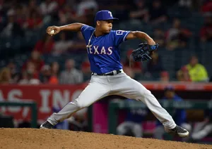 Mlb Players Compete In A Hard Fought Game Wallpaper