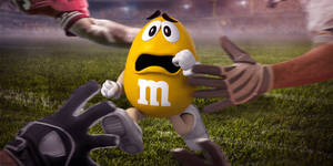 Mms Yellow On Football Field Wallpaper