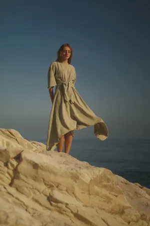 Model Gaia Vigo Pajon Shows Off A Stunning Designer Dress, Perfect For A Summer's Day. Wallpaper