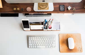 Modern Desk Setupwith Tech Accessories Wallpaper