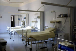 Modern Hospital Bed In An Emergency Room Wallpaper