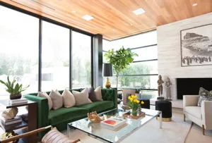 Modern Living Room With Green Sofaand Wooden Ceiling Wallpaper