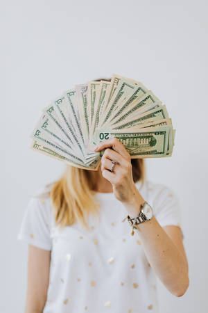 Money Background Woman Holding Stack Of Money Wallpaper