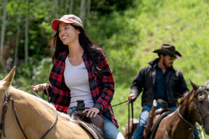 Monica And Rip Engaged In A Dramatic Scene In Yellowstone Tv Show Wallpaper