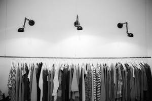 Monochrome Clothes Rack With Light Wallpaper