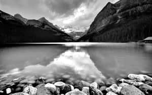 Monochrome Mountain Lake With Rocks Wallpaper