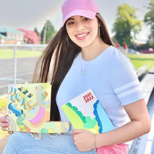 Moriah Elizabeth Holding Art Books Wallpaper