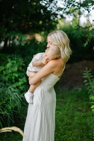 Mother Child Tender Embrace Wallpaper