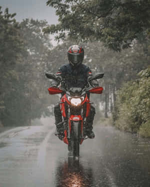 Motorcyclistin Rain Wallpaper