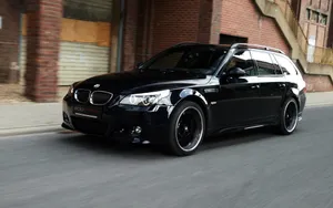 Moving Black Bmw In Highway Wallpaper