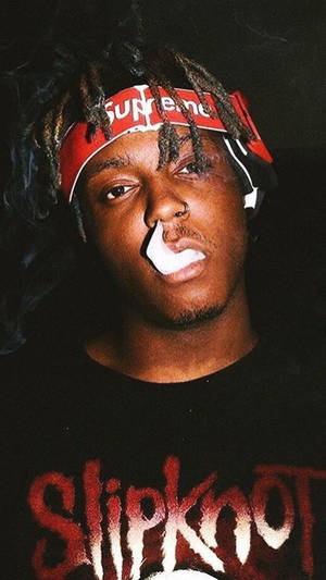 Music Legend Juice Wrld Escapes The Chaos And Sadness Of Life In The Colors Of His Own Unique Aesthetic Wallpaper