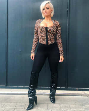 Music Sensation Bebe Rexha Glows On Stage Wallpaper