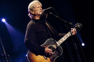 Musicianin Concertwith Guitar Wallpaper