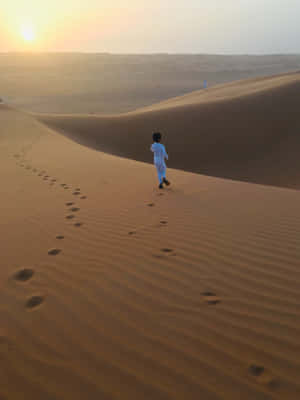 Muslim Boy In The Desert Wallpaper