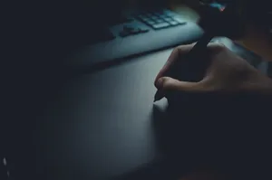 Mysterious Anime Character Enveloped In Shadows Wallpaper