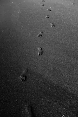 Mysterious Footprints On A Black Background Wallpaper