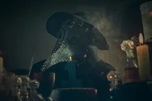 Mysterious Plague Doctorby Candlelight Wallpaper