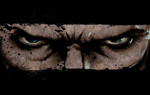 Mysterious Woman In A Hooded Cloak On A Gloomy Forest Pathway Wallpaper