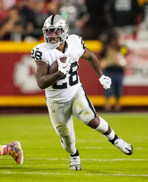 N F L Running Back In Action.jpg Wallpaper