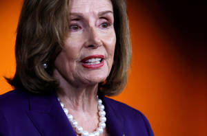 Nancy Pelosi Orange Black Background Wallpaper