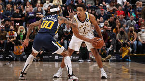 Nba Stars Malcolm Brogdon And Jordan Clarkson In Action Wallpaper