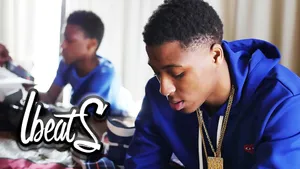 Nba Youngboy In Blue Hoodie Wallpaper