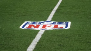 Nfl Football Logo On Field Wallpaper