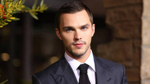 Nicholas Hoult Looking Dapper In A Sharp Suit Wallpaper