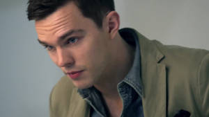 Nicholas Hoult Staring Upward Wallpaper