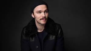 Nicholas Hoult Wearing Bonnet Wallpaper