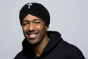 Nick Cannon Posing With Black Turban Wallpaper