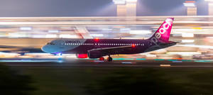 Night Boarding Of Peach Aviation Wallpaper