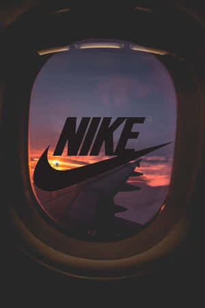 Nike Logo In The Window Of An Airplane Wallpaper