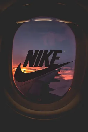 Nike Logo In The Window Of An Airplane Wallpaper