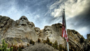 Nimbus Clouds Forming Above Mount Rushmore Wallpaper