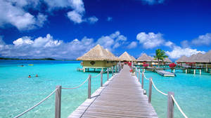 Nipa Huts On Beach In Maldives Desktop Wallpaper