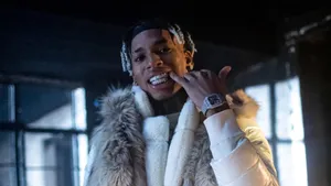 Nle Choppa In White Jacket Wallpaper