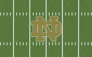 Notre Dame Football Team Showcased At Notre Dame Stadium Wallpaper