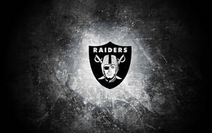 Oakland Raiders Logo On Black Shield Wallpaper