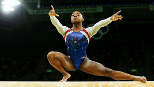 Olympian Simone Biles Showing Off Her Medal Collection Wallpaper