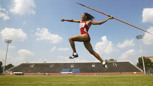 Olympic Javelin Throwers Stretching In The Sun Wallpaper