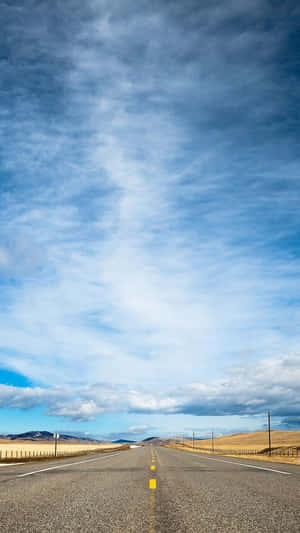 Open Road Under Expansive Sky Wallpaper