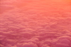 Orange Aesthetic Fluffy Clouds Wallpaper