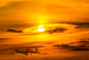 Orange And Yellow Sky With Sun Wallpaper