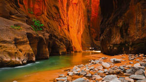 Orange Cave With River Wallpaper