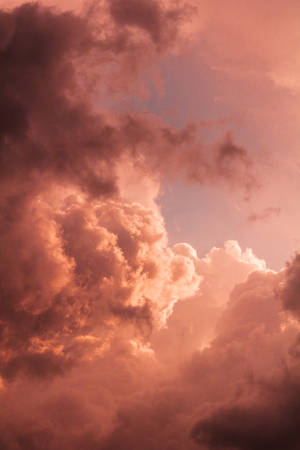 Orange Clouds Illuminated By Pastel Light Wallpaper