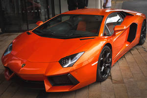 Orange Lamborghini Aventador Front And Side Wallpaper