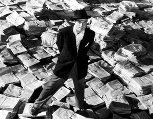 Orson Welles Pondering Scene In Citizen Kane Wallpaper