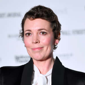 Oscar Awarded Actress Olivia Colman Captured In An Elegant Pose Wallpaper