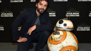 Oscar Isaac With Star Wars Robot Wallpaper